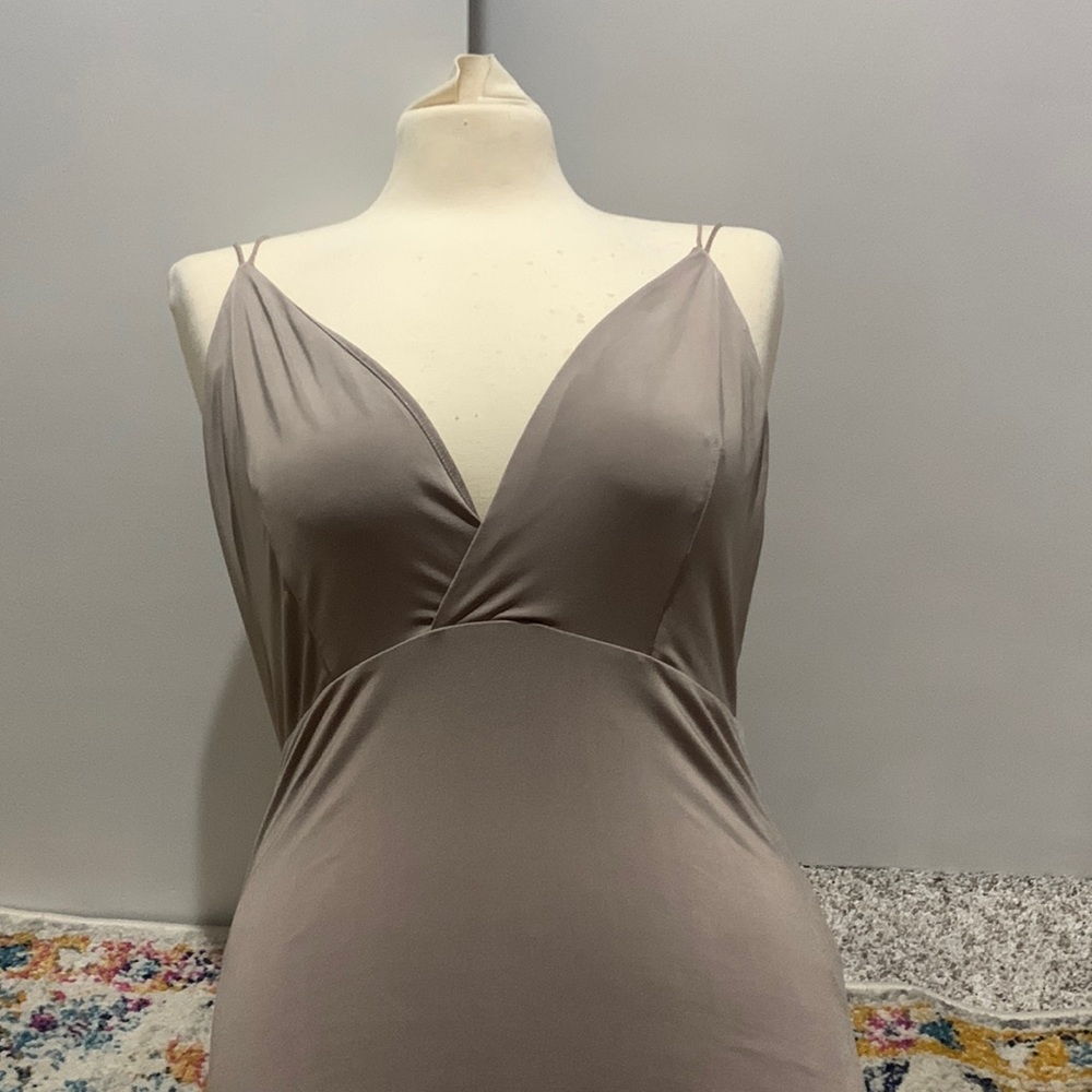 Tan body suit. Size large. Open back. Worn.